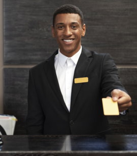 male-receptionist-suit-offering-room-key23.jpg